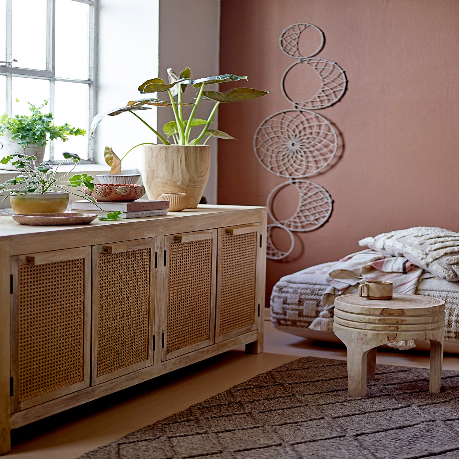 Two rounded Paulownia wood pots, one smaller and one larger, with a natural wood finish displaying beautiful wood grains.